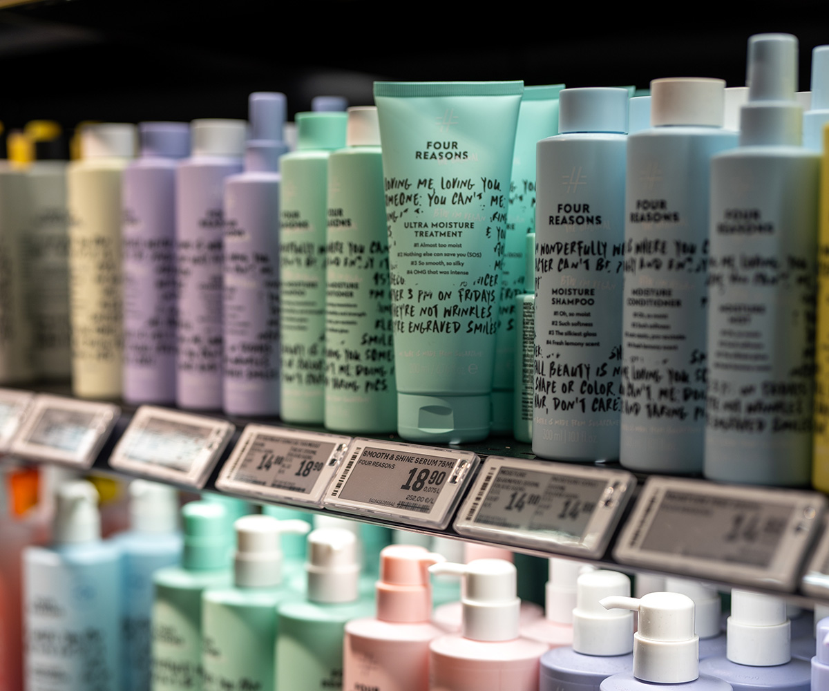 Shelf displaying Four Reasons skincare and hair care products