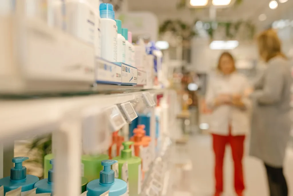 Pharmacy shelf with skincare, hygiene, and medical products in retail store